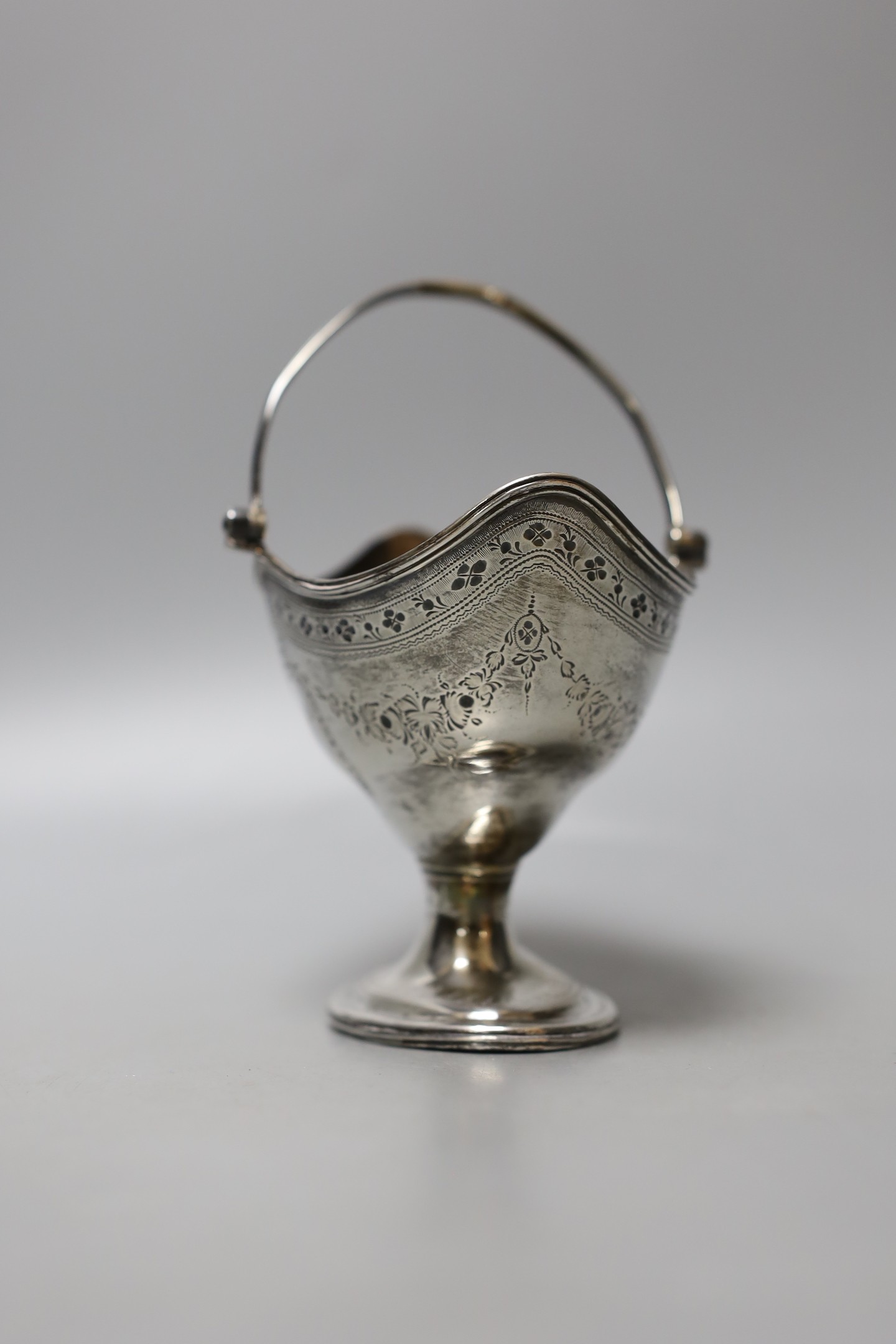 A George III silver oval sugar basket, maker C.S, London, 1787, width 12.1cm, 156 grams.